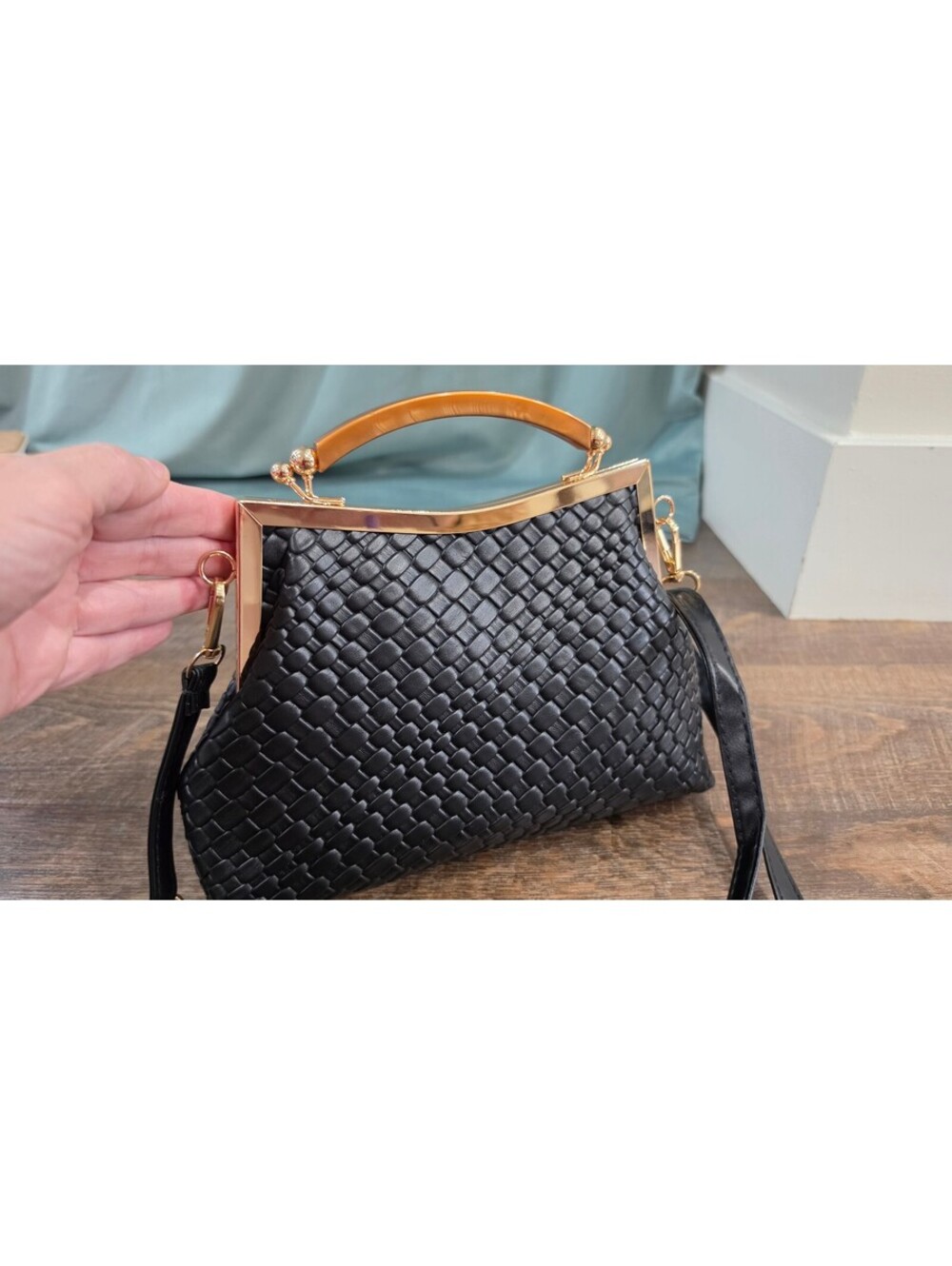 Elegant Black Woven Faux Leather Frame Handbag with Gold Accents